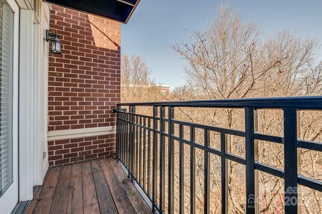a view of wooden balcony with a pot