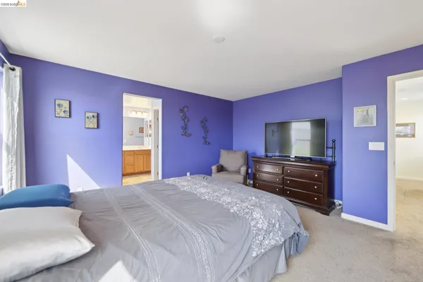 a bathroom with a granite countertop sink mirror and bathtub