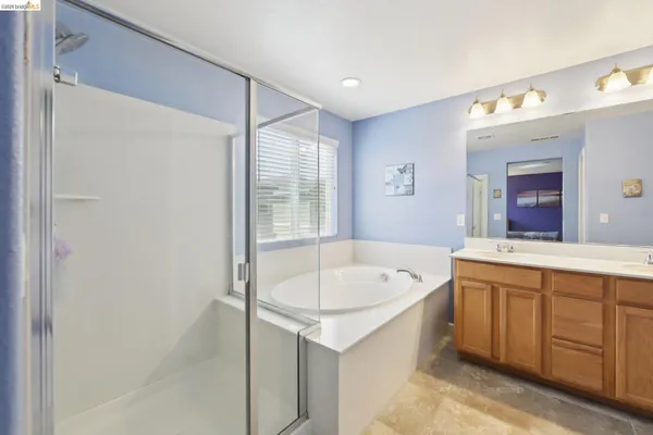 a bathroom with a sink vanity and a mirror