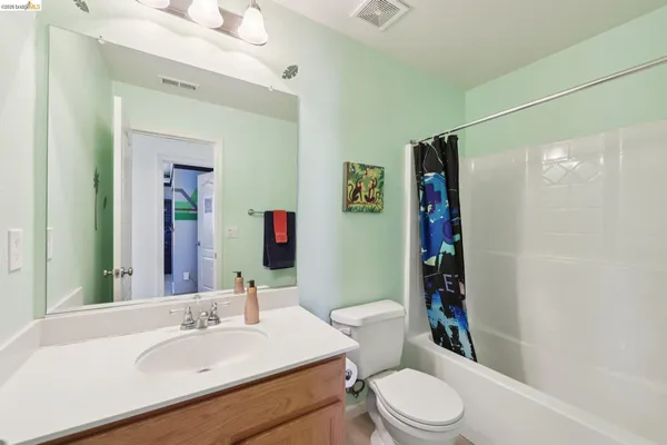 a view of a house with backyard and porch