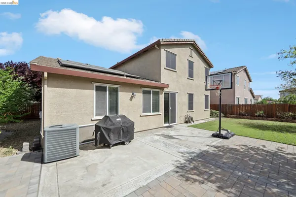 a view of a backyard with sitting area