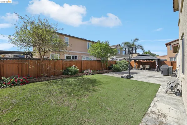 a front view of a house with yard and porch