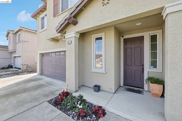 a view of a house with a bench