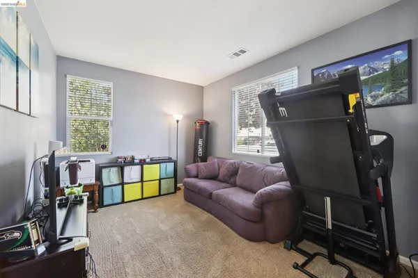 a bedroom with furniture and a window