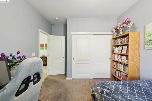 a bedroom with a workspace