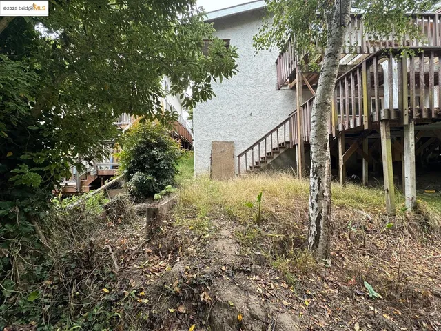 a backyard of a house with lots of green space