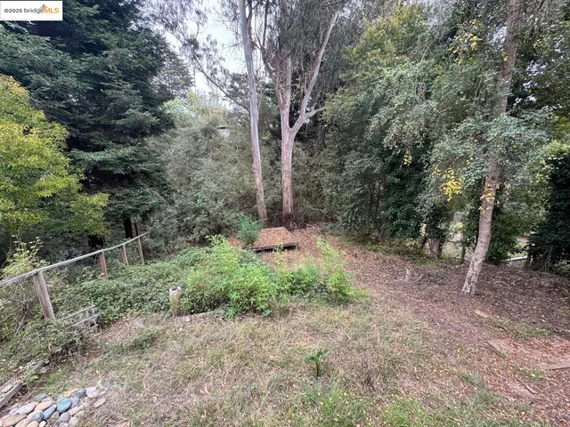a wooden bench sitting in front of a building