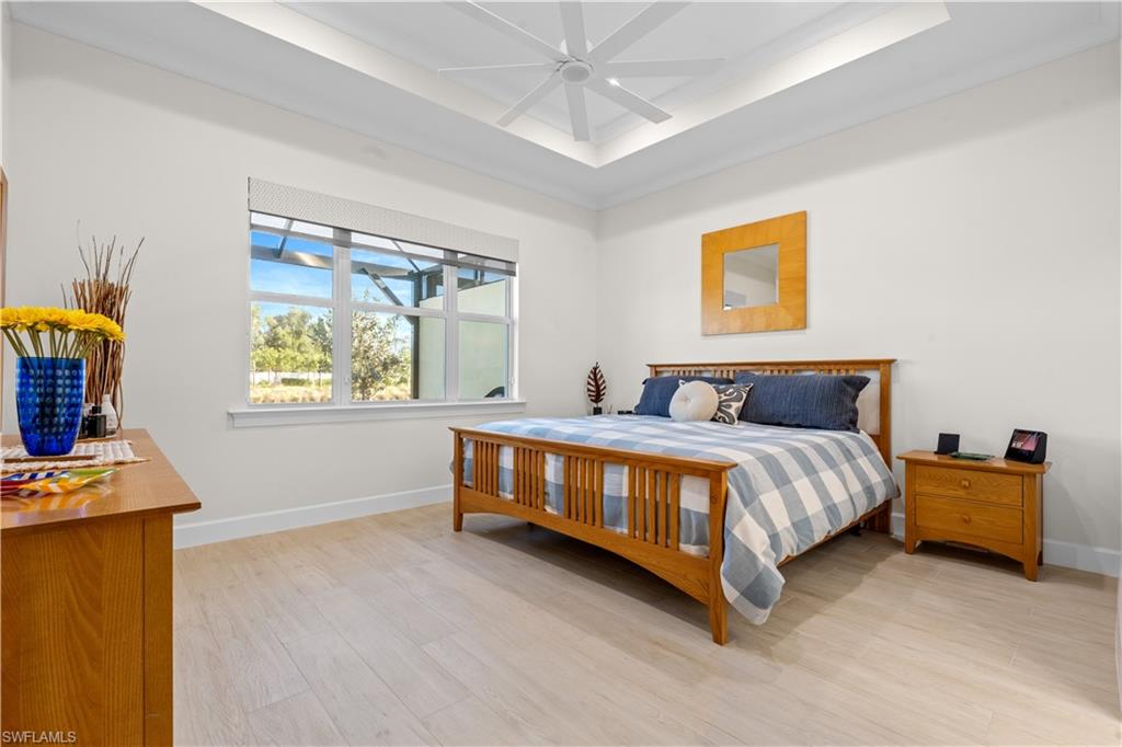 8781 Yucatan Court Naples, FL 34113 - Photo 16 of 36 a bedroom with a bed and window