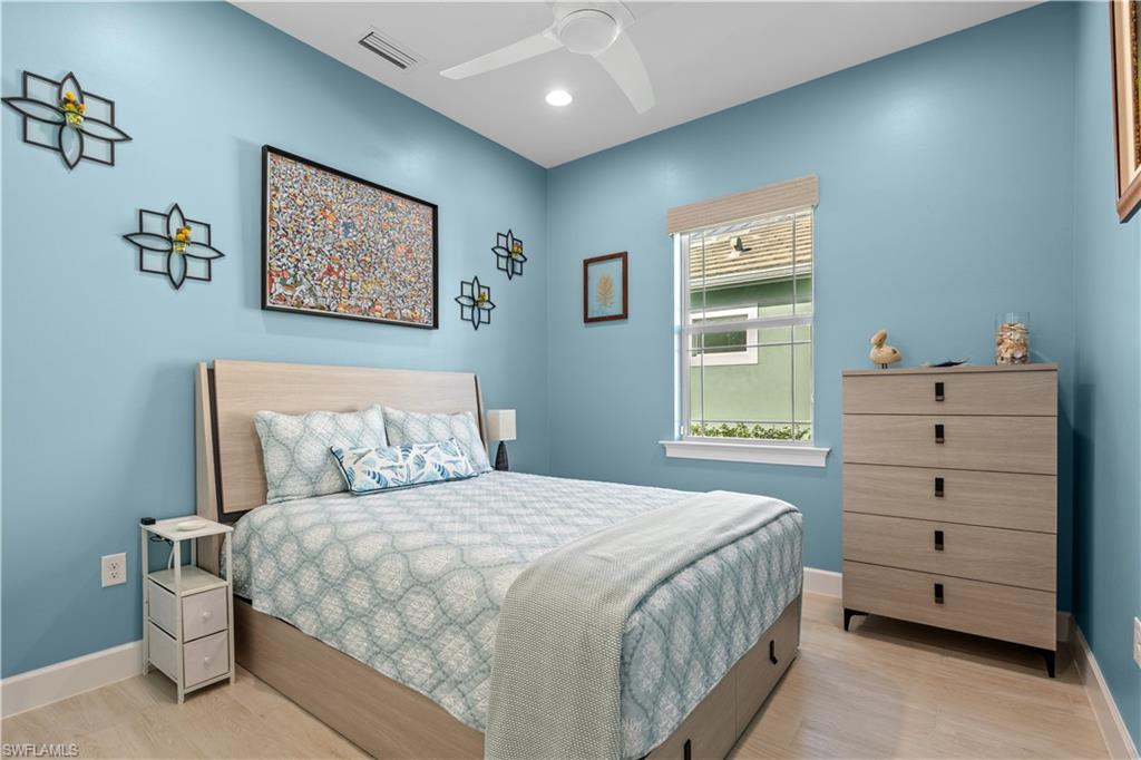 8781 Yucatan Court Naples, FL 34113 - Photo 23 of 36 a bedroom with a bed and a window