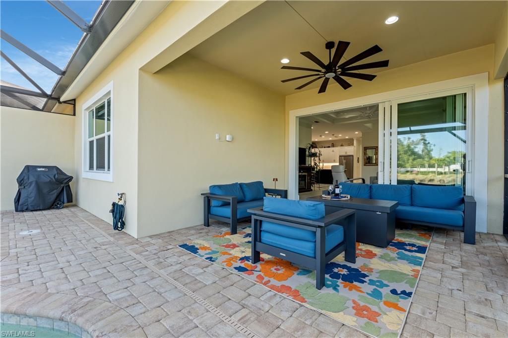 8781 Yucatan Court Naples, FL 34113 - Photo 27 of 36 a living room with furniture and a window