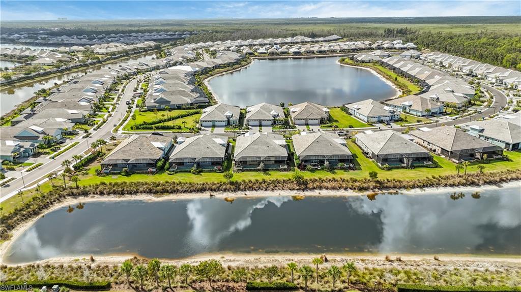 8781 Yucatan Court Naples, FL 34113 - Photo 3 of 36 an aerial view of residential houses with outdoor space