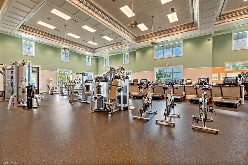 8781 Yucatan Court Naples, FL 34113 - Photo 33 of 36 a view of a room with gym equipment