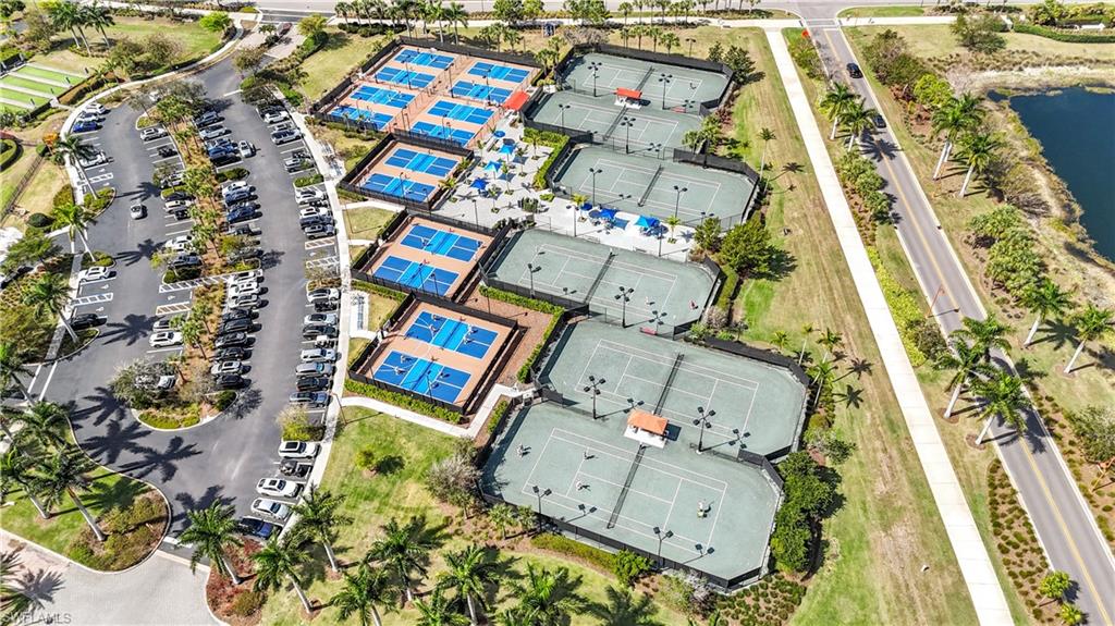 8781 Yucatan Court Naples, FL 34113 - Photo 34 of 36 an aerial view of a residential apartment building with yard