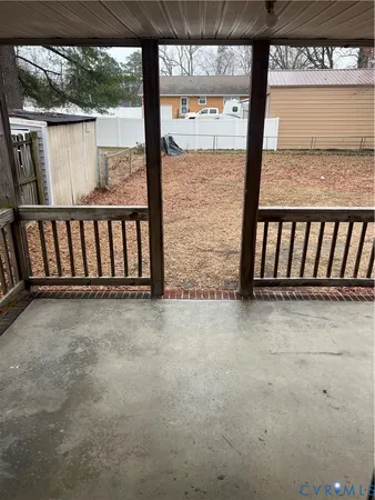 a view of an empty room with a floor to ceiling window