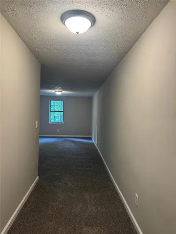 an empty room with a empty space and window