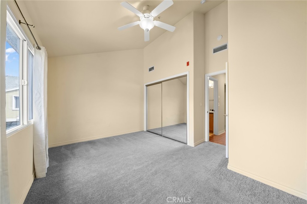 1500 Pine Avenue, Unit 9 Long Beach, CA 90813 - Photo 17 of 30 an empty room with a ceiling fan and a bathroom