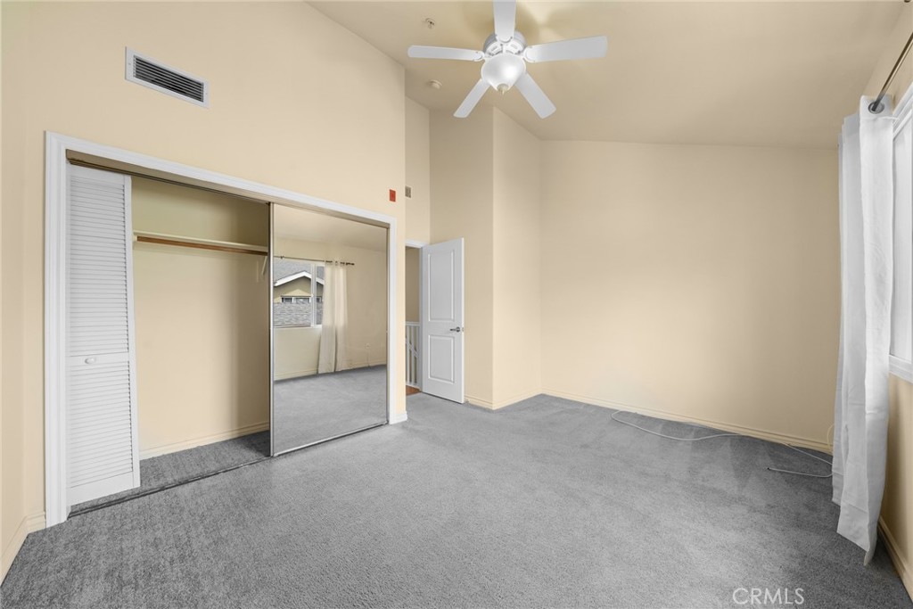 1500 Pine Avenue, Unit 9 Long Beach, CA 90813 - Photo 18 of 30 an empty room with a ceiling fan and a window