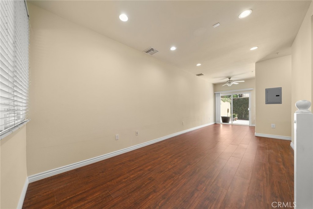 1500 Pine Avenue, Unit 9 Long Beach, CA 90813 - Photo 26 of 30 an empty room with wooden floor and windows