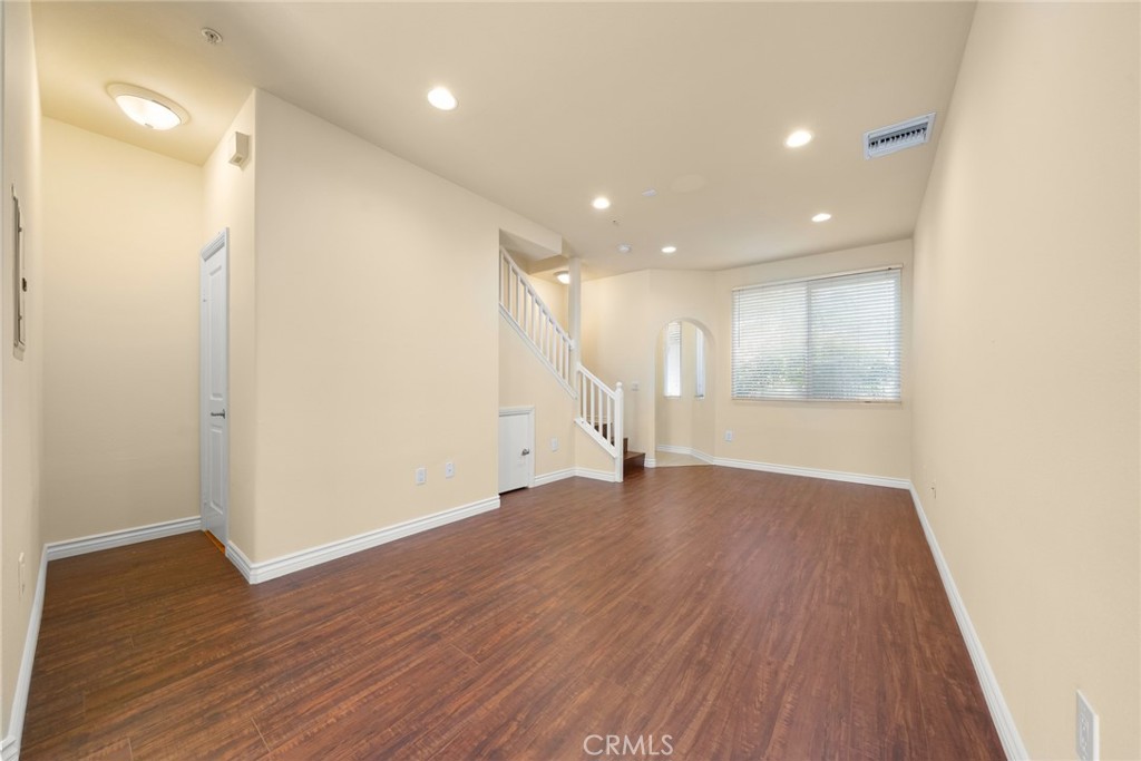 1500 Pine Avenue, Unit 9 Long Beach, CA 90813 - Photo 28 of 30 a view of an empty room with wooden floor and a window