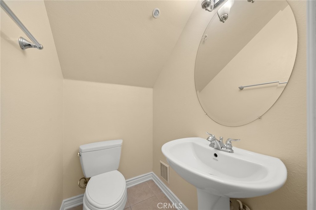 1500 Pine Avenue, Unit 9 Long Beach, CA 90813 - Photo 29 of 30 a bathroom with a sink a mirror and toilet