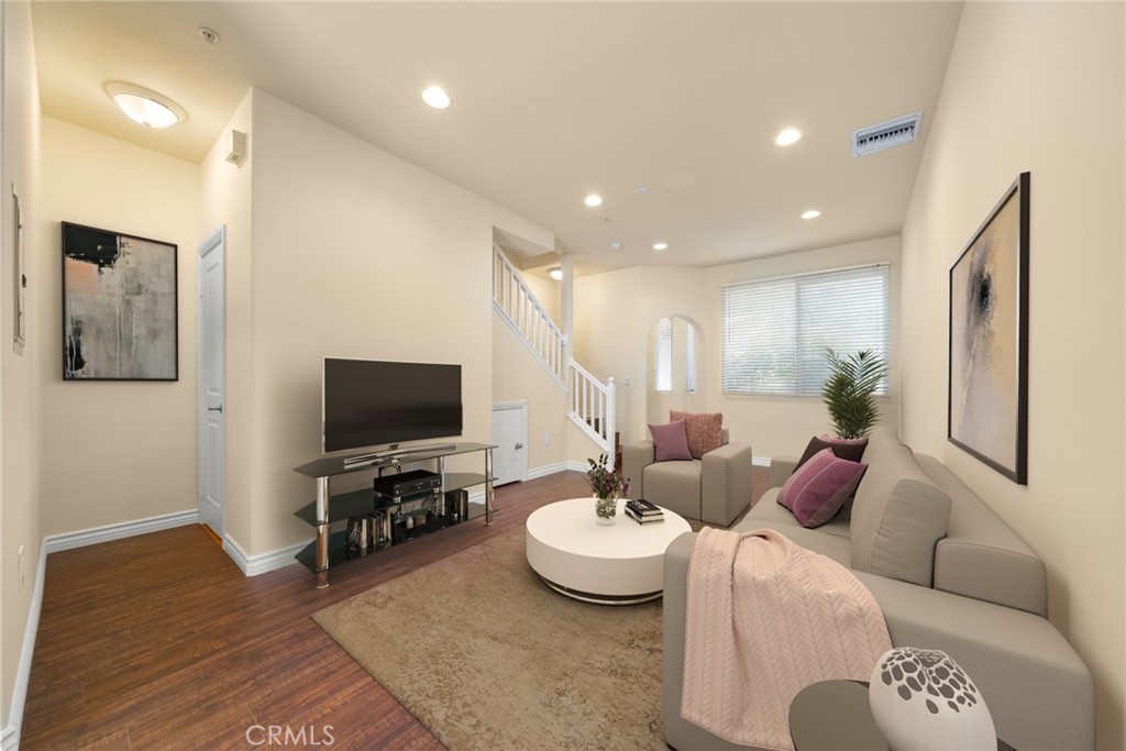 1500 Pine Avenue, Unit 9 Long Beach, CA 90813 - Photo 3 of 30 a living room with furniture and a flat screen tv