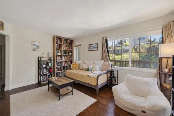 a living room with furniture and a large window