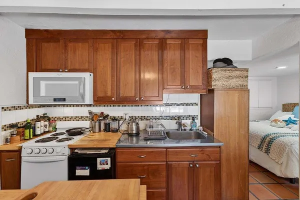 a kitchen with a stove and a microwave