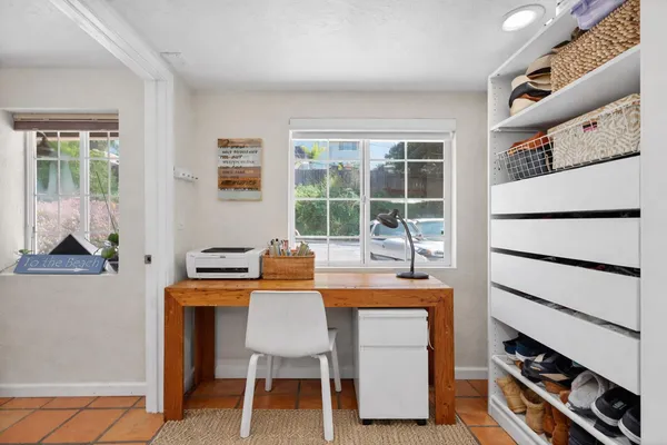 a dining room with furniture and window