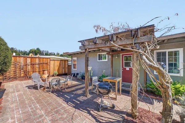 a patio with table and chairs