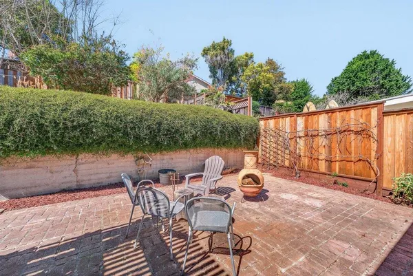 a view of a chairs and table on the terrace