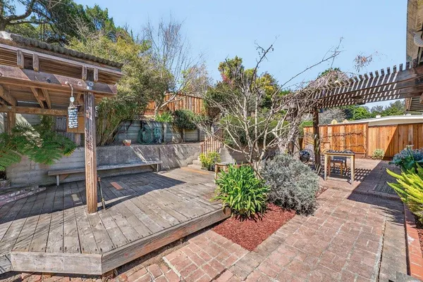 a view of a backyard with sitting area