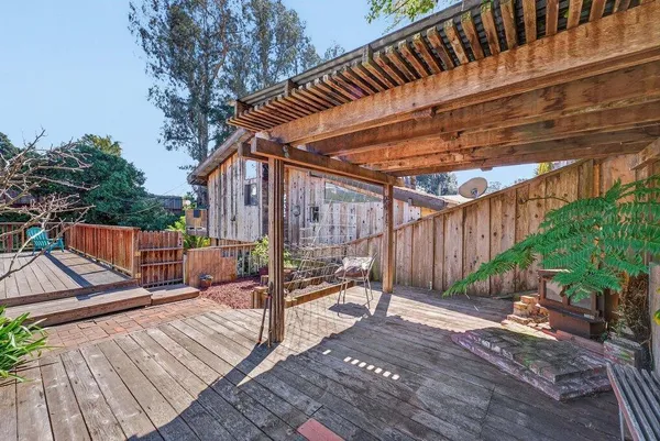 a view of deck with wooden floor and outdoor seating