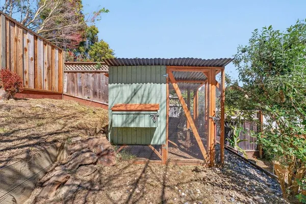 a blue bench sitting in front of a house