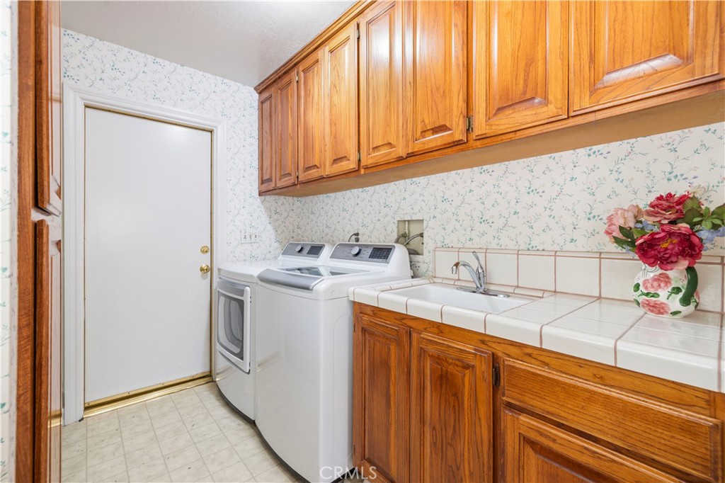 25707 Pacy Street Newhall, CA 91321 - Photo 54 of 62 downstairs laundy room