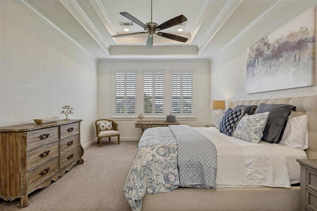 641 Maggie Trail Lucas, TX 75002 - Photo 17 of 37 a bedroom with a bed and a dresser