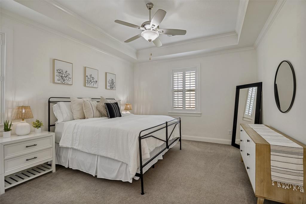 641 Maggie Trail Lucas, TX 75002 - Photo 20 of 37 a bed room with a bed and a chandelier