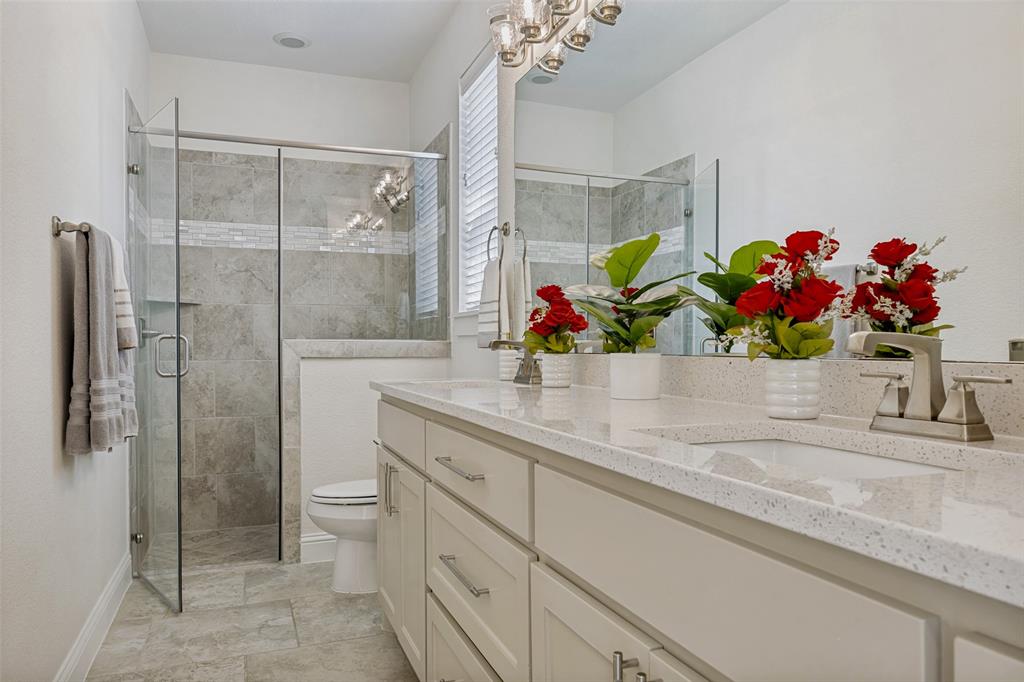 641 Maggie Trail Lucas, TX 75002 - Photo 21 of 37 a bathroom with a sink mirror and shower