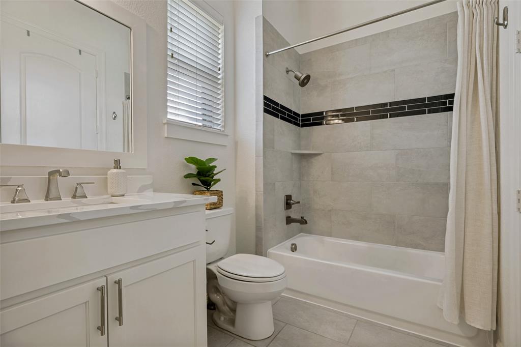 641 Maggie Trail Lucas, TX 75002 - Photo 25 of 37 a bathroom with a granite countertop sink a toilet and shower