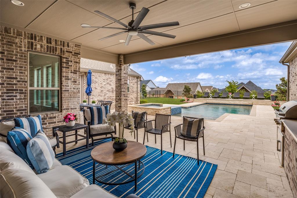 641 Maggie Trail Lucas, TX 75002 - Photo 28 of 37 a living room with furniture and a floor to ceiling window