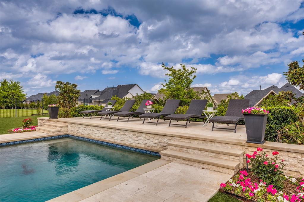 641 Maggie Trail Lucas, TX 75002 - Photo 31 of 37 a view of a swimming pool with a lounge chairs