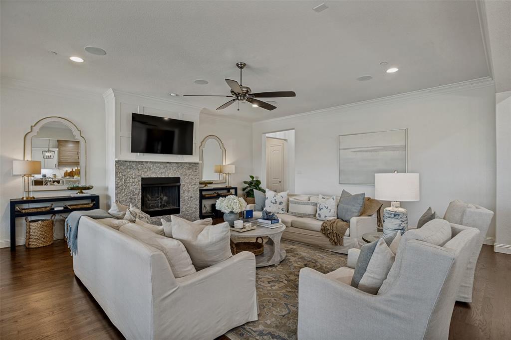 641 Maggie Trail Lucas, TX 75002 - Photo 8 of 37 a living room with furniture a fireplace and a flat screen tv