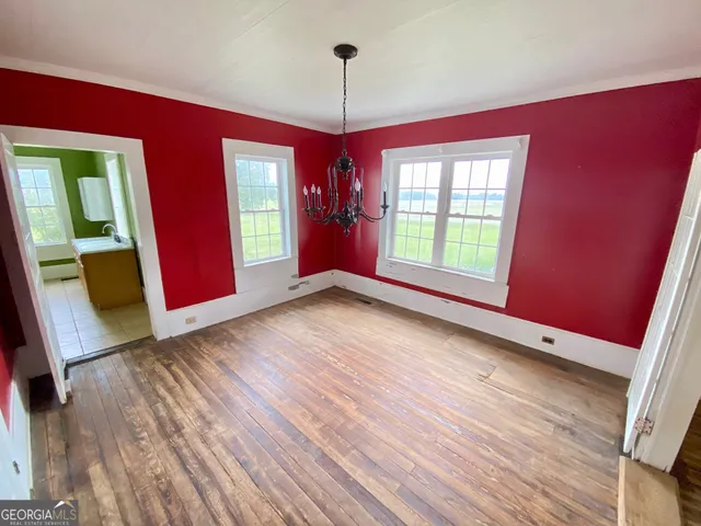 a view of a entryway with furniture and chandelier