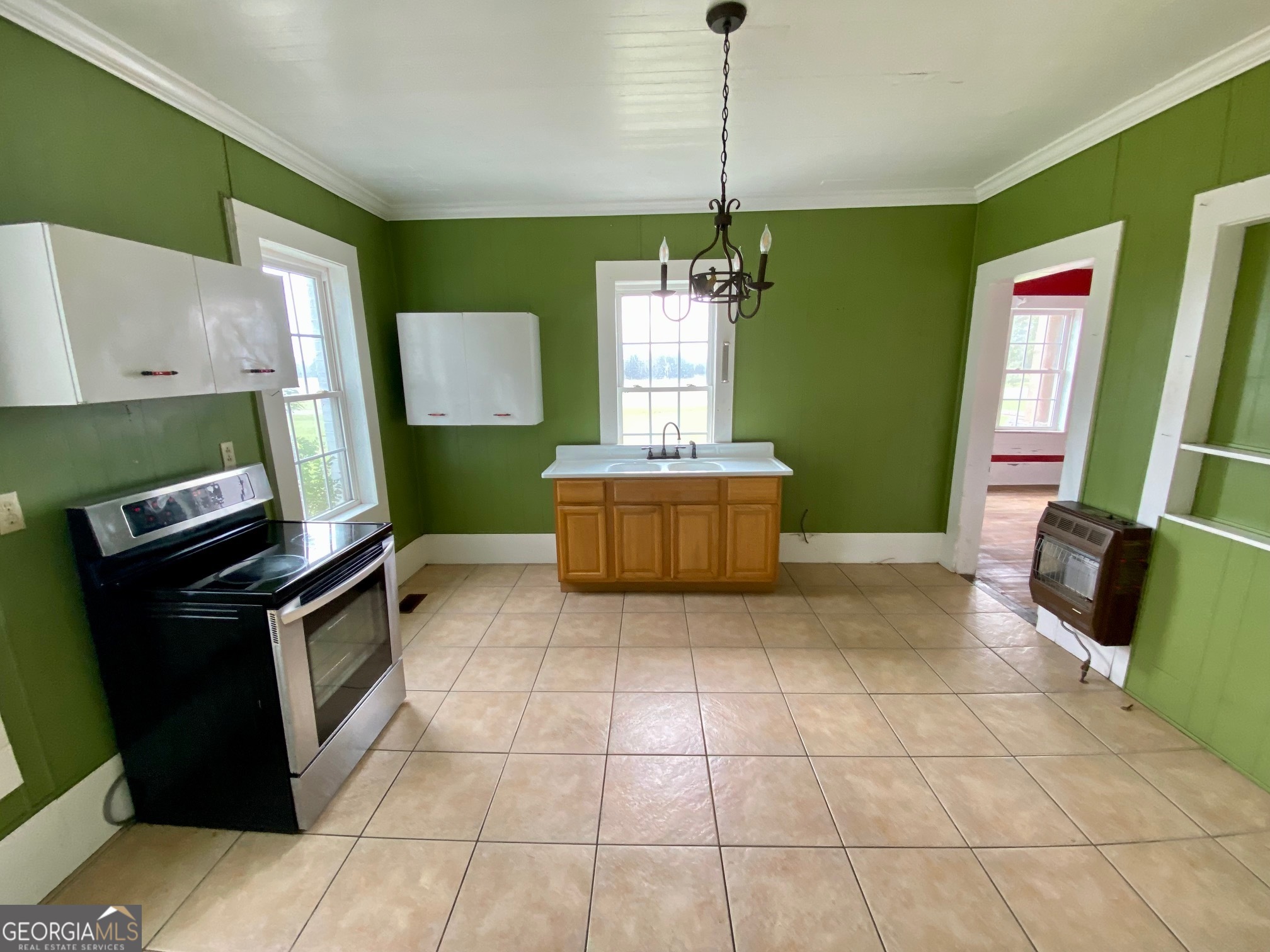 1088 Tippettville Road Pineview, GA 31071 - Photo 15 of 33 a kitchen with kitchen island a counter top space appliances and a window
