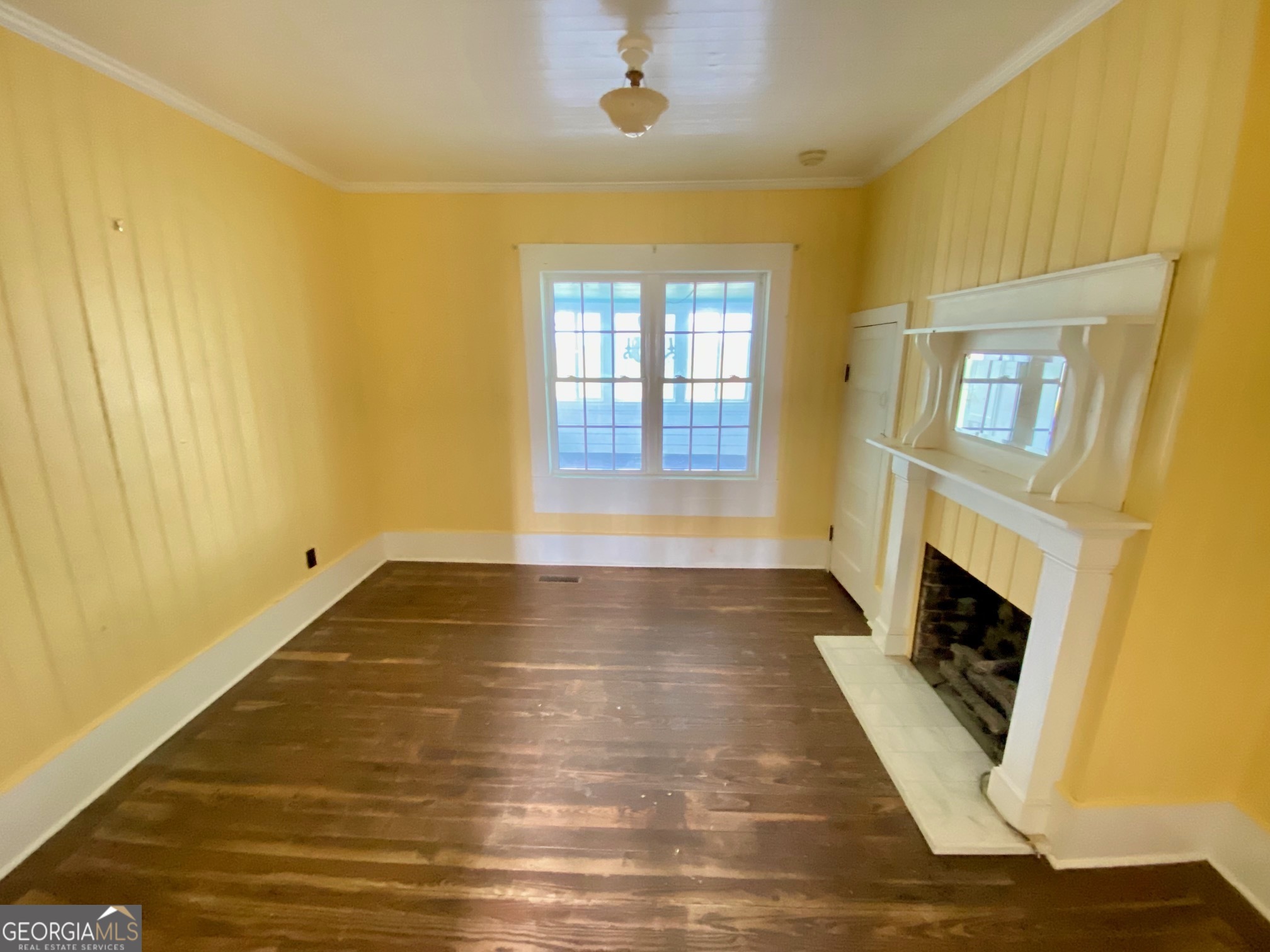 1088 Tippettville Road Pineview, GA 31071 - Photo 19 of 33 a view of an empty room with a fireplace and a window