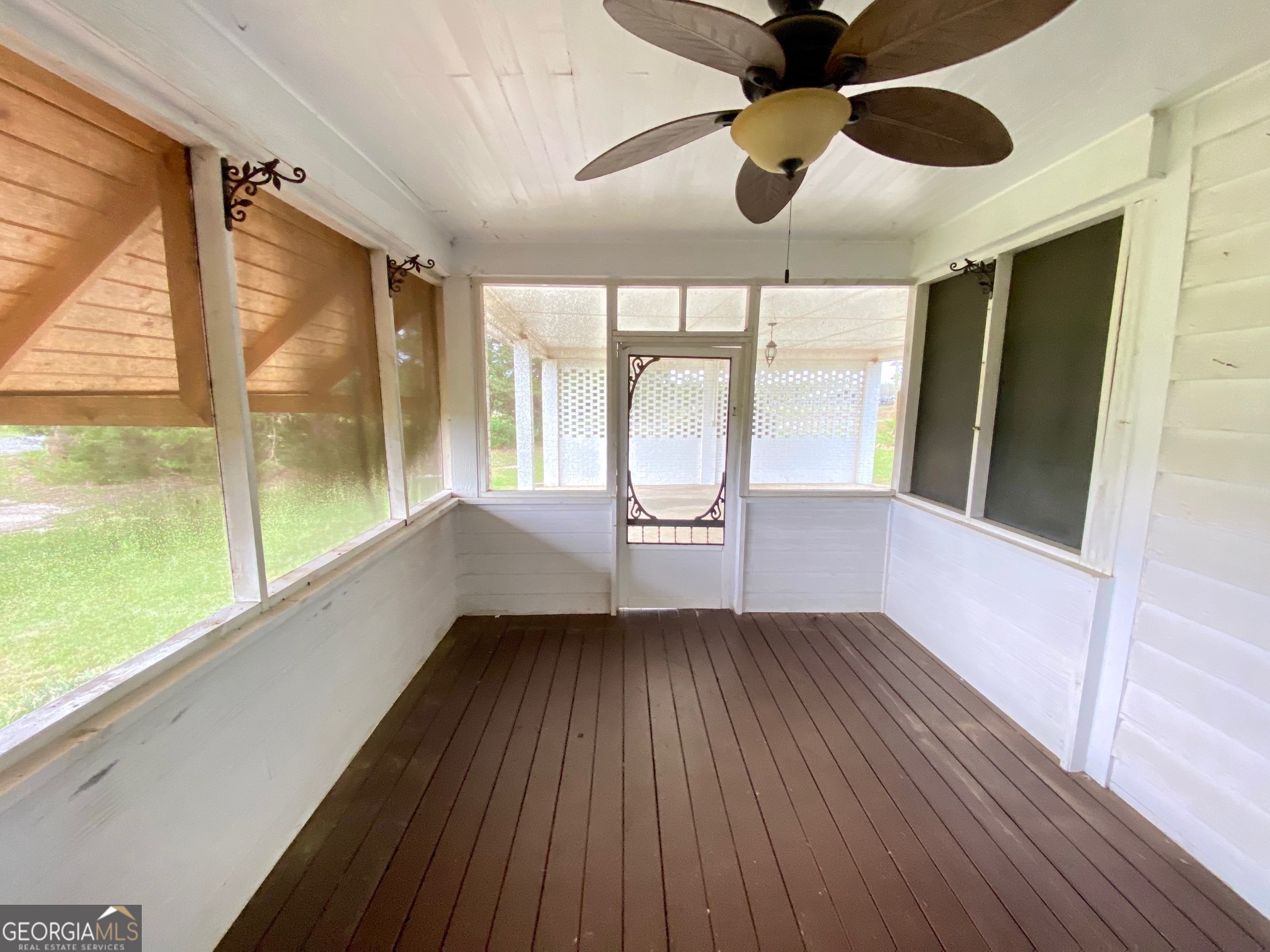 1088 Tippettville Road Pineview, GA 31071 - Photo 27 of 33 a view of an empty room with a window and wooden floor