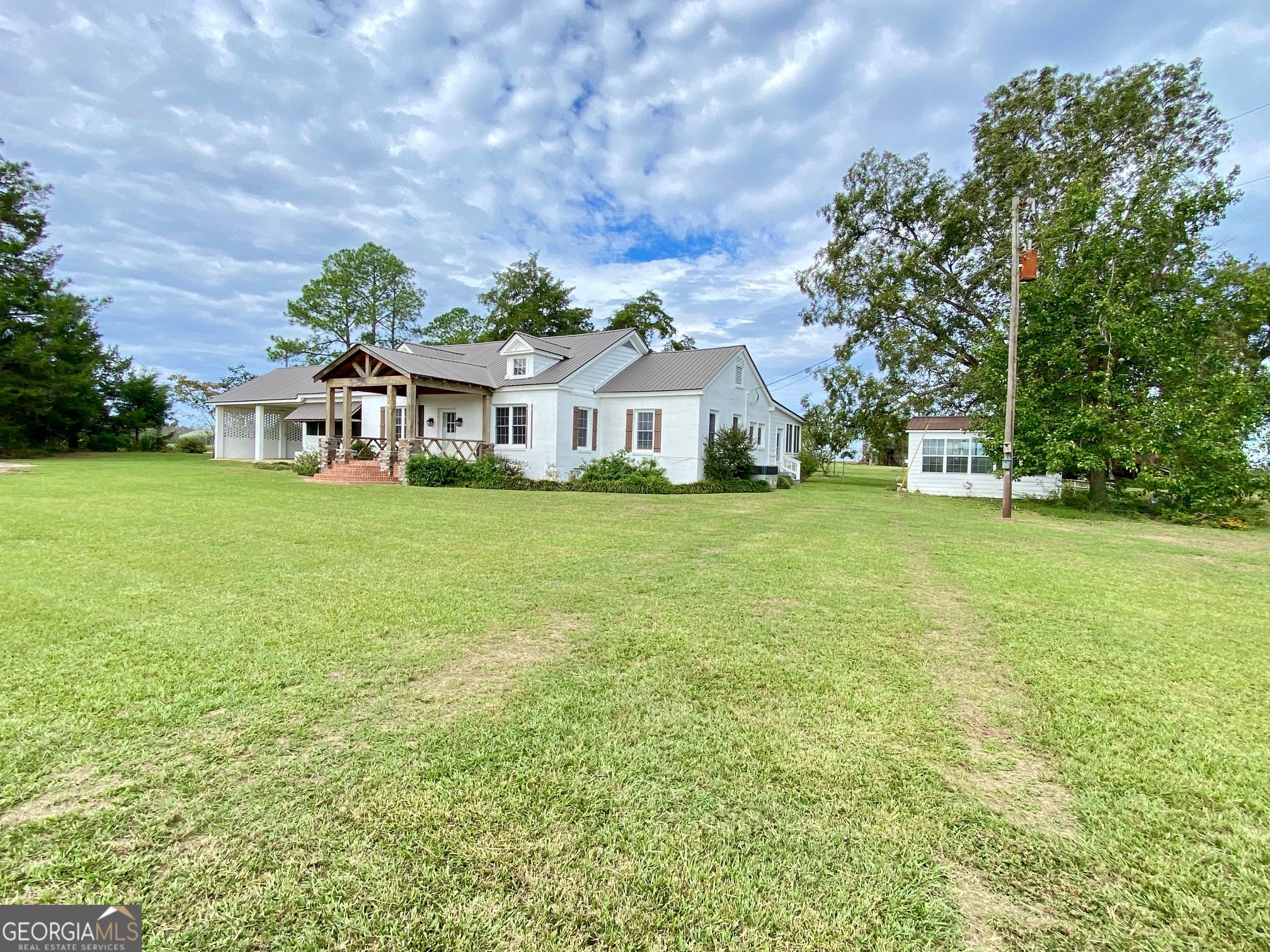 1088 Tippettville Road Pineview, GA 31071 - Photo 3 of 33 a view of a house with a big yard and large trees