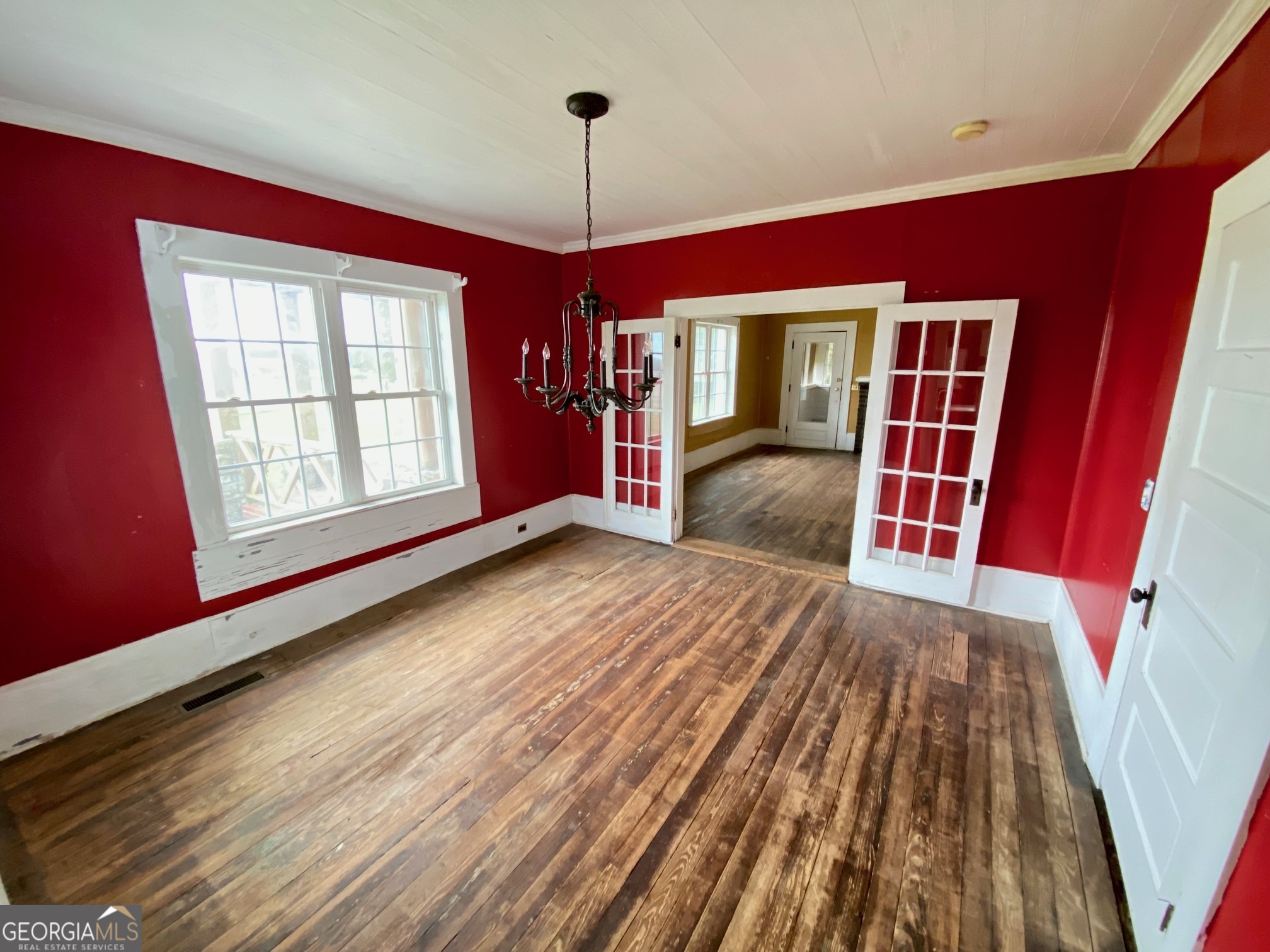 1088 Tippettville Road Pineview, GA 31071 - Photo 10 of 33 a view of an empty room with wooden floor and a window