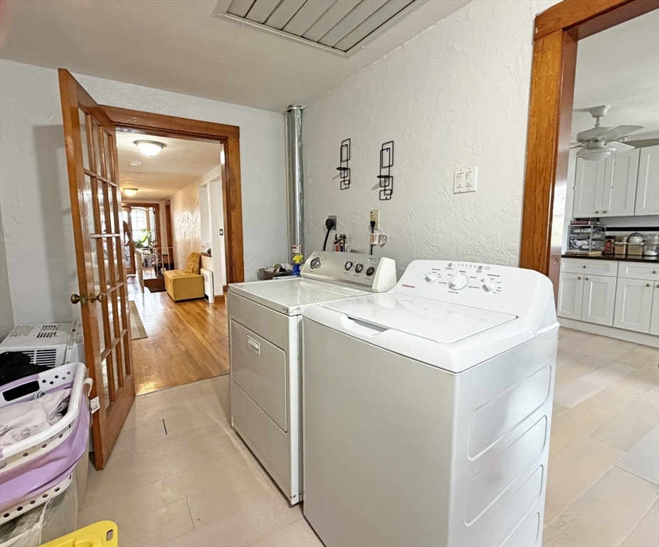 75-77 Dale Street, Unit 77 Waltham, MA 02451 - Photo 11 of 17 a view of living room with washer and dryer