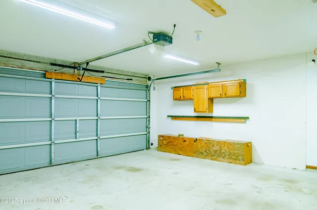 a view of a backyard with a garden and plants