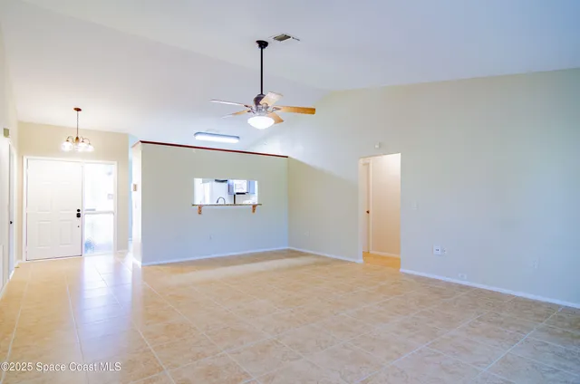 a view of a livingroom with a refrigerator